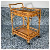 RATTAN BAR CART | Rattan bar cart with bent wood frame, on casters. Dimensions: h. 35 x w. 18 x l. 3