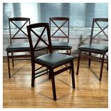 (4pc) WOOD FOLDING SIDE CHAIRS | Having black faux leather cushioned seats with dark wood frames Dim