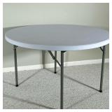 CIRCULAR FOLDING TABLE | Round heavy plastic folding table. Dimensions: dia. 47 in
