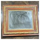 CARVED WOOD MIRROR | Beveled glass mirror in carved wood & gilt frame - h. 26 x w. 30 in.