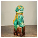 CHINESE FOO DOG CERAMIC FIGURE | Marked Hong Kong and with numbers. Green painted ceramic dog sittin