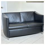 CONTEMPORARY BLACK LEATHER LOVESEAT | Two-seat sofa with machined metal legs Dimensions: h. 29 x w. 
