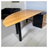 DAVIS FURNITURE CURVED DESK | Curved front wood desk with round metal legs and attached 3-drawer fil