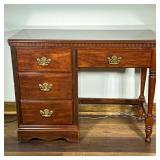 Four-Drawer Wooden Desk | Four-drawer wooden desk with gold hardware and carved details. - h. 31 x w