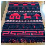 Peruvian Artwork Wall Hanging | Peruvian hand-woven red and black wall hanging with a llama design. 