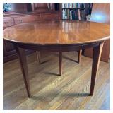Round Extending Dining Table | Vintage (mid 20th c.) round wooden extending dining table with three 