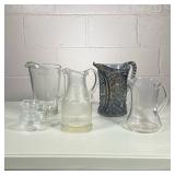 (5pc) Glass Pitchers | Including two blown glass pitchers, one non-descript, one etched glass, and a