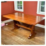 Trestle Dining Table | Finished wood farmhouse style kitchen table with seating for 6, having a nice