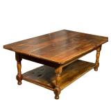Rustic wooden Coffee Table | Rustic table with lower shelf, carved legs and rough wood with knots. -