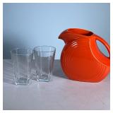 (3pc) Pitcher And Glasses | Orange Fiesta pitcher and two Nespresso glasses. - h. 7.5 x l. 9 in (Pic