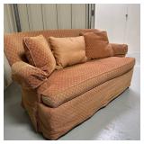 Burnt Orange Loveseat/Sofa | Single cushion loveseat/sofa in burnt orange colored upholstery with th