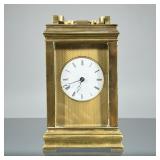 “AB” BRASS CARRIAGE CLOCK | Heavy, with beveled glass panels, white face set in a brass engine turne