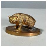 GOFFE & CARKENER CO BRASS BEAR | Brass bear figurine paperweight from Goffe & Carkener Co, with clov