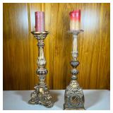 (2pc) Gilt Composite Candlesticks | A near pair, gilt carved style candlestick holders - h. 24.75 x 