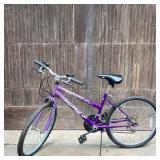 Girl’s Huffy Lakota Mountain Bike | Purple, 5-speed bike. Black adjustable seat, handle brakes. Dime