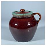 BROWN GLAZE LIDDED CROCK SINGLE LOOP HANDLE | Brown glazed pottery with handle. - h. 6.5 x dia. 7 in