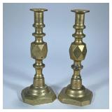 PAIR LARGE BRASS GEOMETRIC CANDLESTICKS | Thick and heavy with geometric shape in center. Dimensions