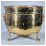 LARGE BRASS LIONS HEAD PLANTER JARDINIERE | Brass with 3 claw feet. Lion ring handles. Dimensions: h