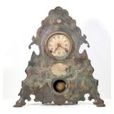UNUSUAL CAST IRON SHELF CLOCK | Paint-decorated cast iron front - h. 20 x w. 18 x d. 4.75 in