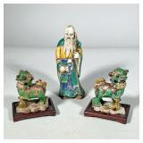 (3pc) CHINESE CERAMIC FIGURES | Including a pair of green glazed pottery foo lions/foo dogs on a sta