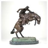 AFTER FREDERIC REMINGTON, BRONZE | Bronco Buster. With triangle marking on rear of horse, on a green