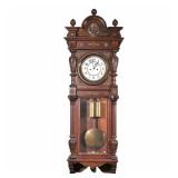 REGULATOR WALL CLOCK | White enameled face with Arabic numeral markers in a carved walnut case with 