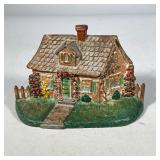 EARLY 20th CENTURY CAST IRON HOUSE DOOR STOP | Painted cast iron cottage-form doorstop with original