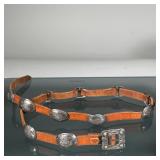 SILVER NAVAJO MINIATURE CONCHO BELT | Designed as a brown leather belt with 12 silver concho station