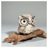 OWL ON BRANCH FIGURE | Stone carved owl sculpture attached to wooden branch Dimensions: h. 5 x l. 9.