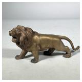 BRASS LION FIGURE | Brass figure of lion roaring. Marked "Made in Japan" and "A" on foot. Dimensions