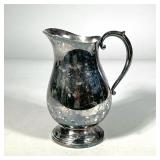 SILVER PITCHER | Having curved handle and pouring spout. Marked "P.S. Co." on bottom. Dimensions: h.