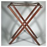 LUGGAGE RACK | Wood folding luggage rack with two fabric-patterned straps. Dimensions: h. 32 x w. 25
