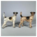 (2pc) Hubley cast iron fox terriers | Metal painted dog door stops by Hubley. - h. 8.5 x w. 4 x l. 8