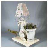Posh Tots Lamp | Bunny holding pot of faux greens and moss mounted on base with round balled feet. F
