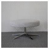 ROYCE MICHAEL WEISS VANGUARD SWIVEL STOOL | Swiveling low stool with textured upholstered cushion ov