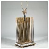 Modernist Brass Rod Table Lamp | An unusual oversized contemporary table lamp having gold / brass ve
