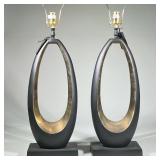 Pair Modern Black Oval Tall Table Lamps | Tall sculptural table lamps, each with an open oval form i