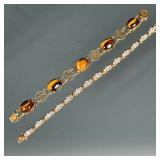 (2pc) STERLING SILVER BRACELETS | Two gold-tone sterling silver bracelets including one diamond simu