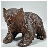 Carved Wood Bear Figure | Heavy carved dark wood bear figure depicted on all fours, with textured fu