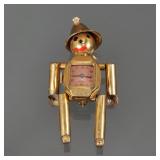 Gold Tone Harman “Tin Man” Watch Figure | Gold tone figure designed as a tin man with movable arms a