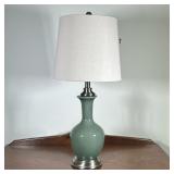 Jade Green Ceramic Table Lamp | Modern jade green ceramic teardrop-shaped table lamp on a chrome bas