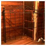 Wrought Iron Headboard | Wrought iron headboard with curled top design and vertical slatted bars for