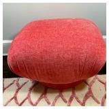 Swivel Pouf/Ottoman (1/2) | Round-based, square-topped swivel pouf/ottoman upholstered in a reddish-