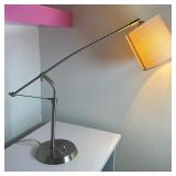 Modern Style Desk/Reading Lamp | Modern style desk/reading lamp with an adjustable arm and a shiny b