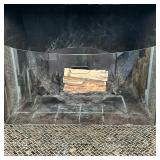 Curved Glass Fireplace Screen | Curved glass fireplace screen, offering a clear view of the flames, 