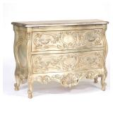 SILVERED ITALIAN BOMBE TWO DRAWER CHEST | Silver finished chest decorated with an overall viney acan