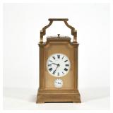 A FANCY THEODORE B. STARR CARRIAGE / TRAVEL CLOCK | Numbered and engraved on bottom. Handle moves ba