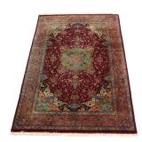 VERY FINE SCULPTED FLORAL TABRIZ RUG | central medallion with four vases full of flowers on a red gr