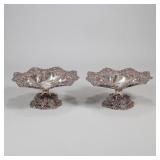 PAIR STERLING SILVER COMPOTES | Matching compotes with raised designs on pedestals and rims. Marked 