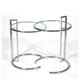 (2pc) PAIR EILEEN GRAY CHROME CHROME & GLASS TABLES | Pair of circular adjustable chrome & glass sid